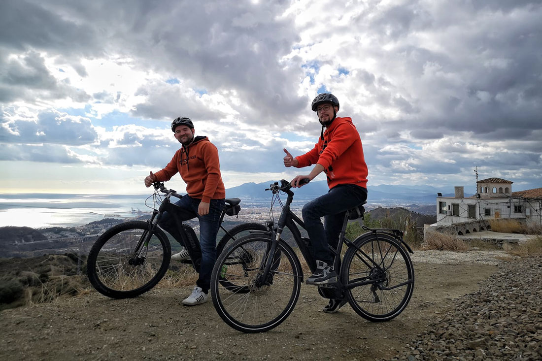 Cycling by the white village Olias during the e-bike tour
