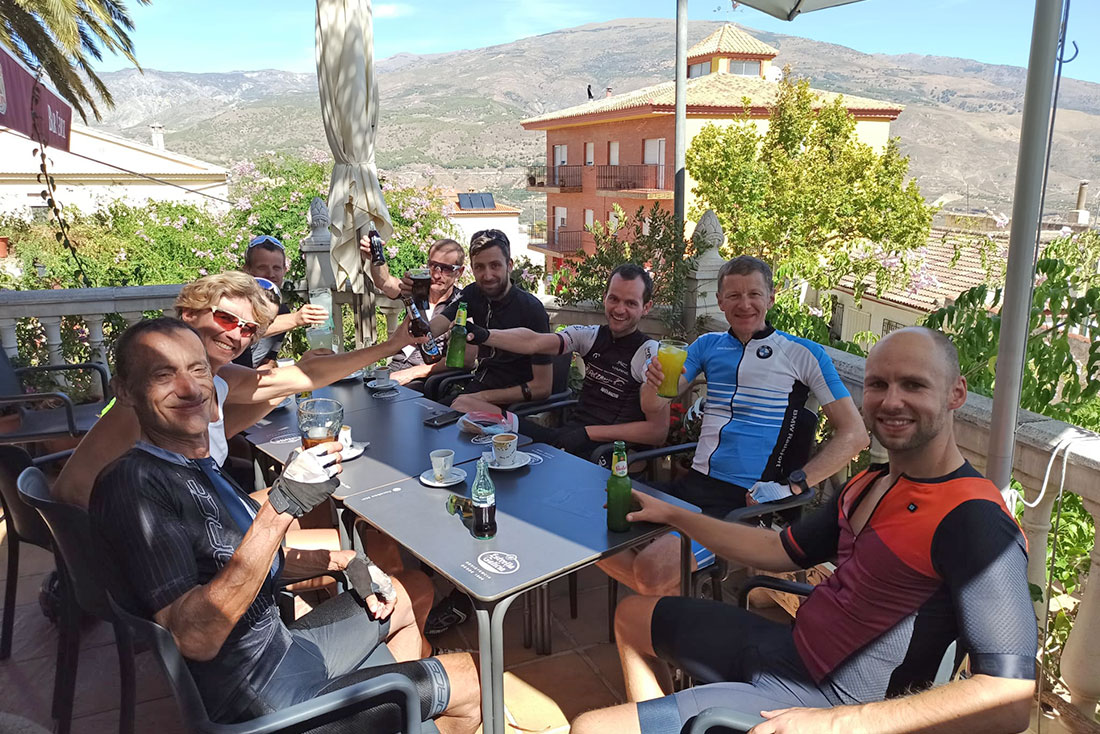 Group of cyclists in cafe during theirs cycling holiday in Andalusia
